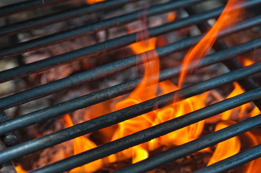 A barbecue grill over the flame