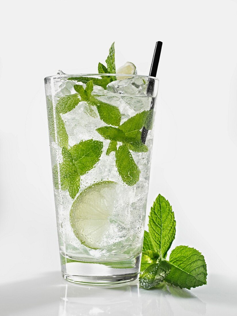 A glass of Mojito with mint and lime