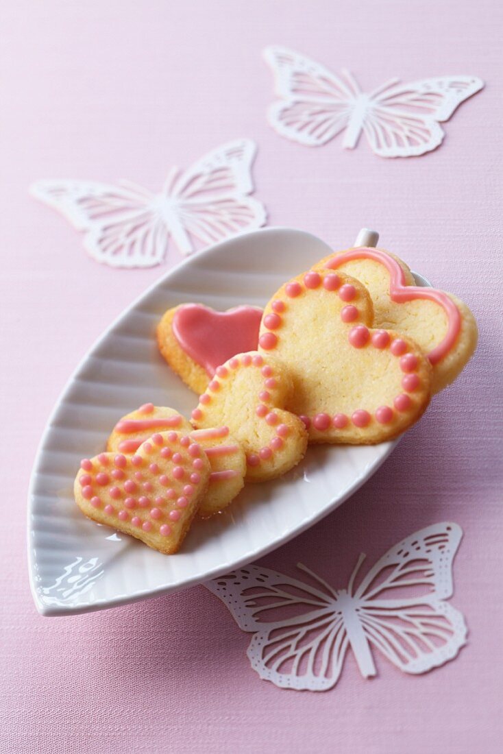 Heart-shaped butter biscuits decorated with pink glac