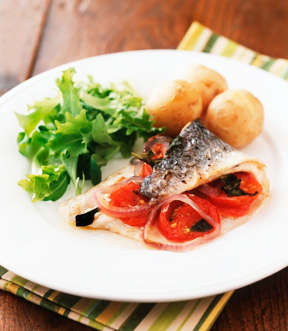 Baked mackerel fillet with tomatoes and red onions