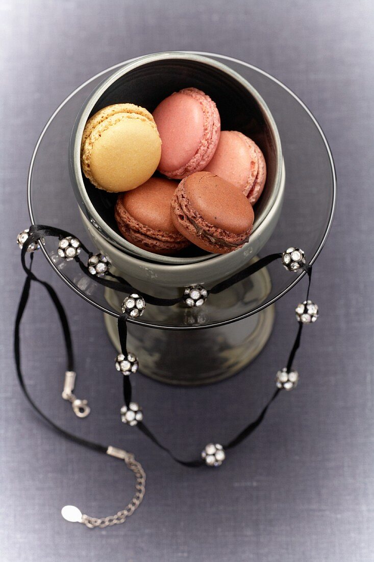 Macaroons in a glass with a necklace