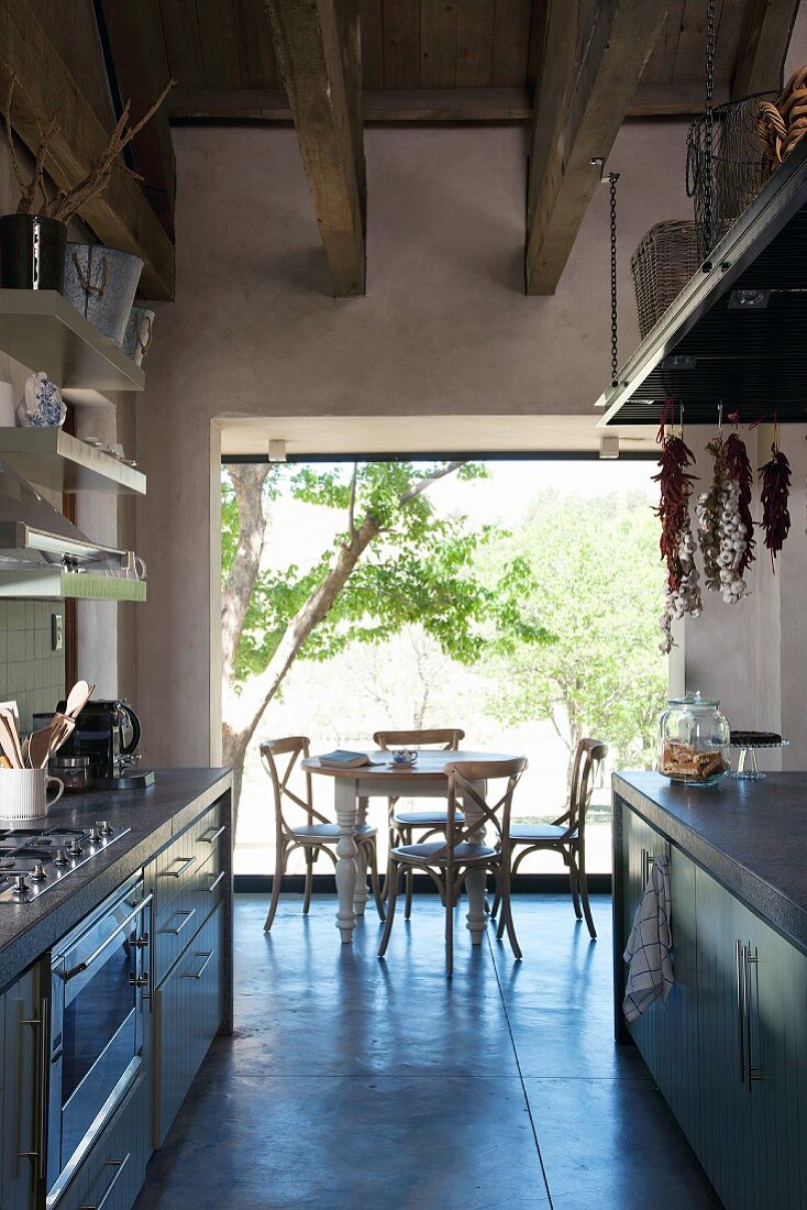 Contemporary kitchen with open doorway leading to dining area