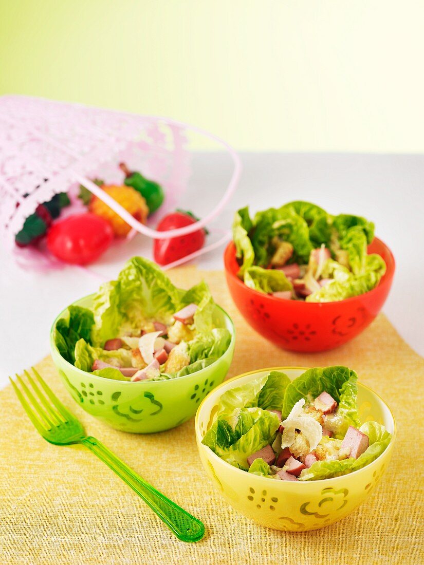 Three bowls of Caesar salad