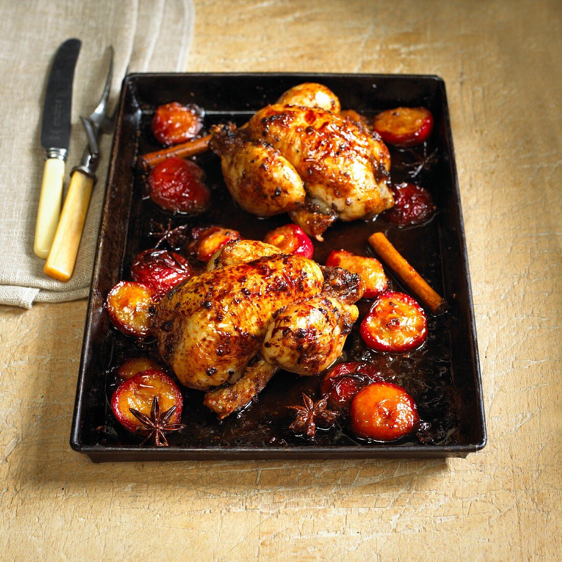 Roasted poussin with star anise, cinnamon and plums