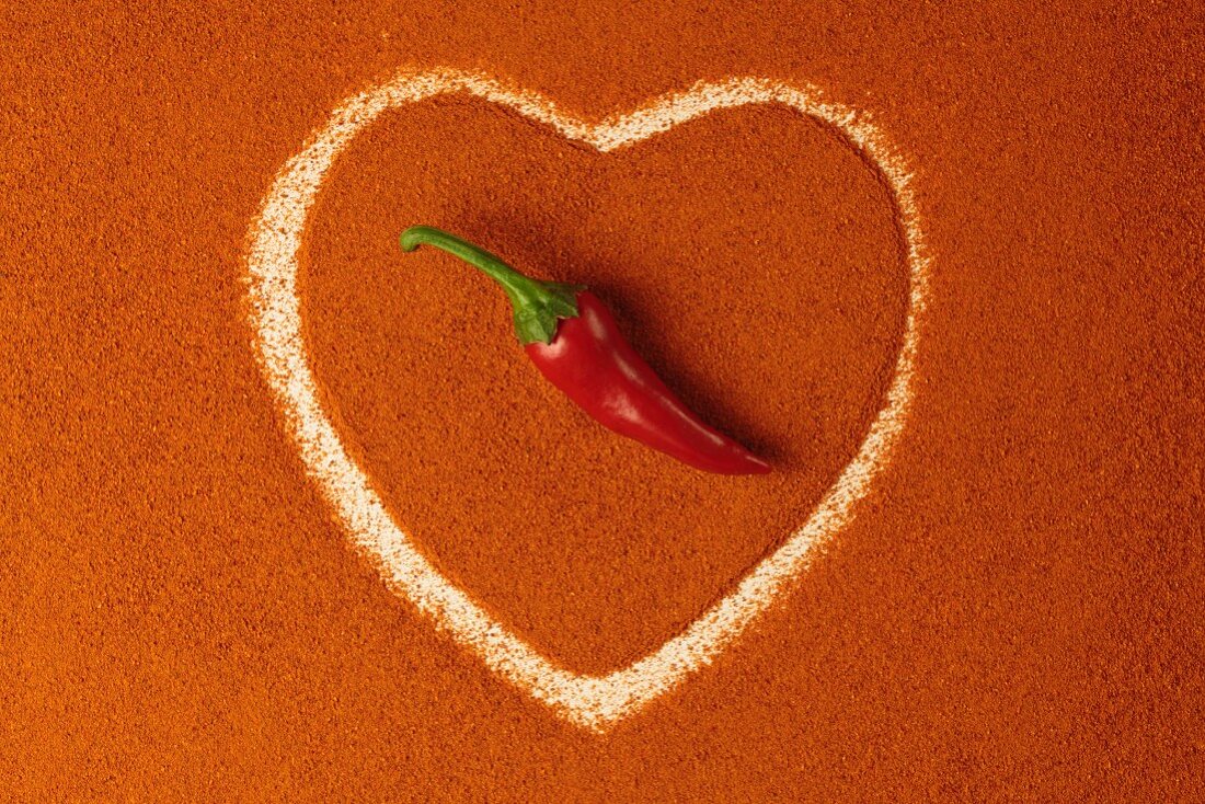 A heart of paprika topped with a chilli pepper