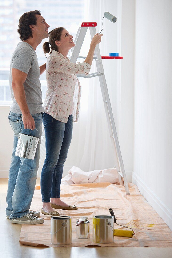 Couple painting walls