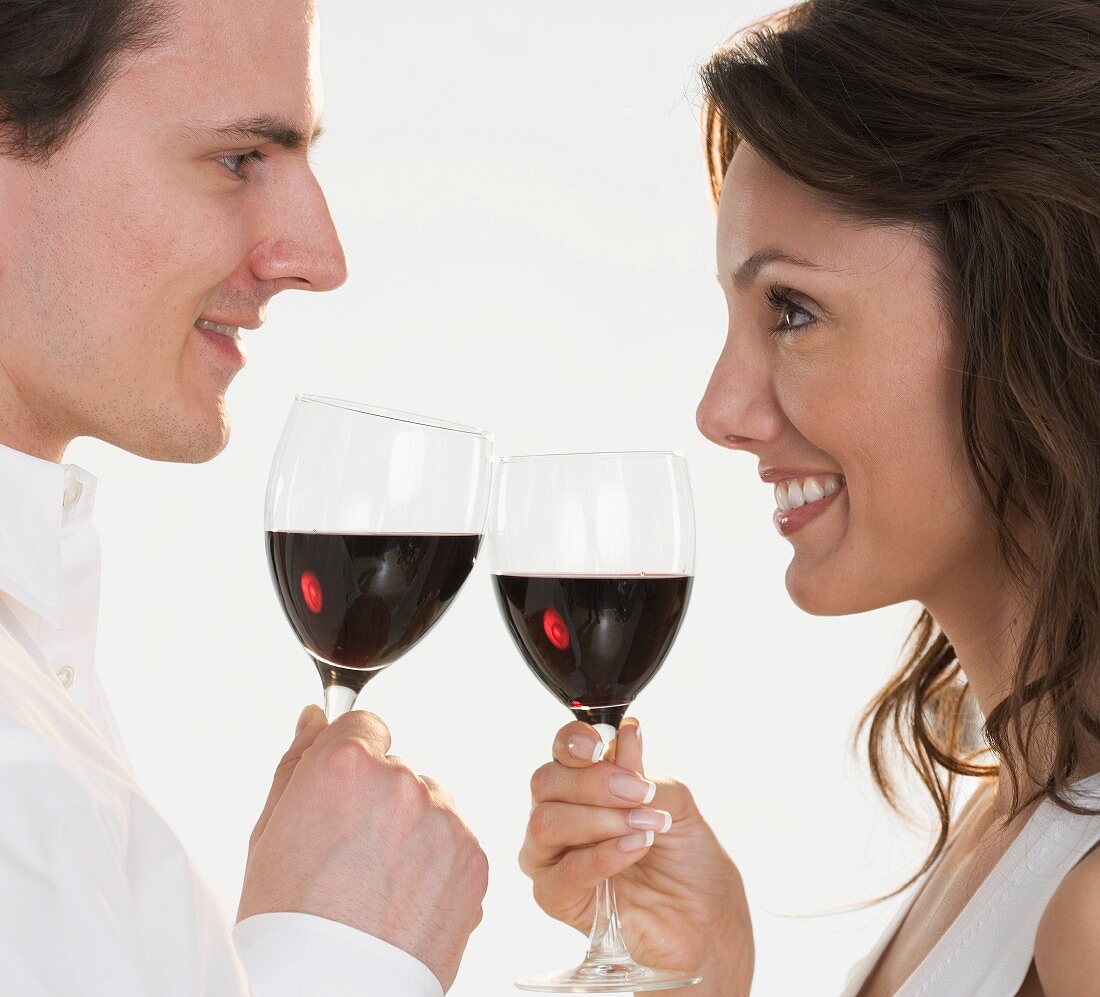 Profile of couple with red wine