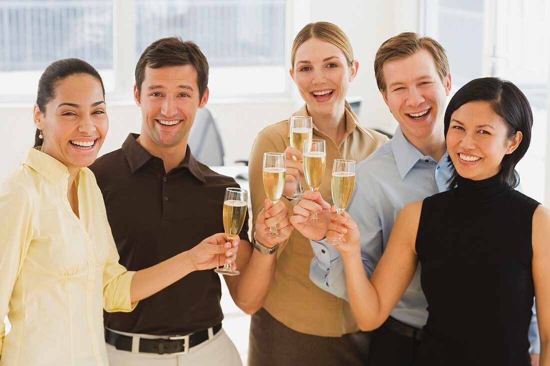 Businesspeople toasting with champagne