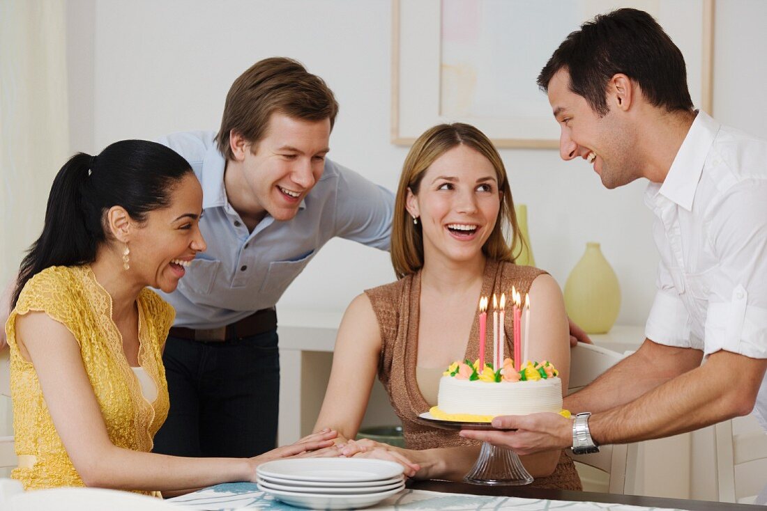 Woman celebrating birthday with friends