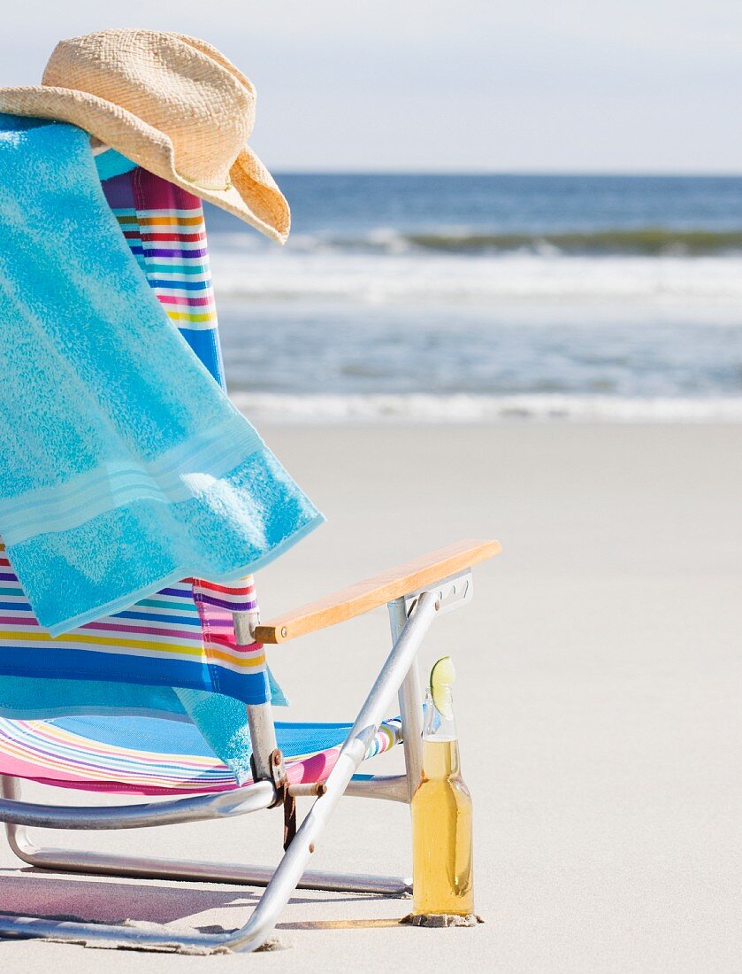 Beer next to beach chair