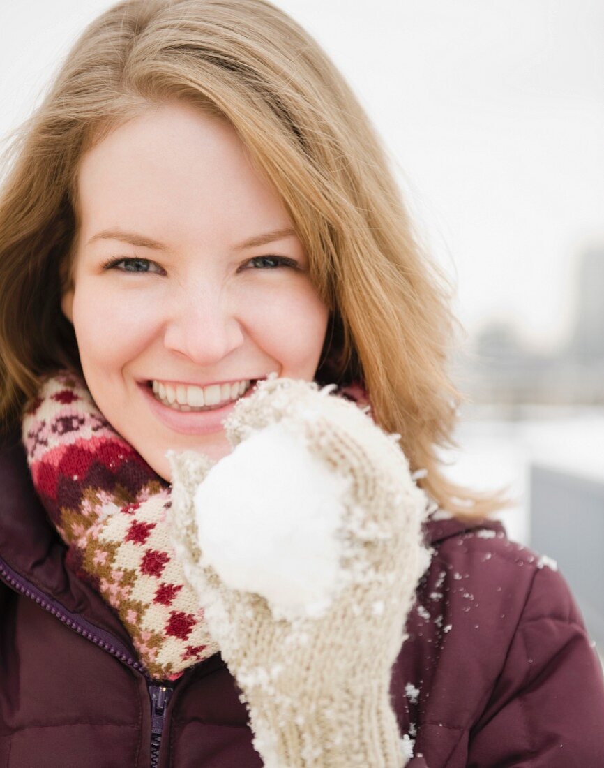 Woman holding a snowball