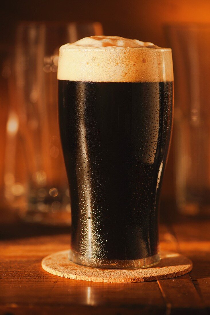 A glass of dark beer