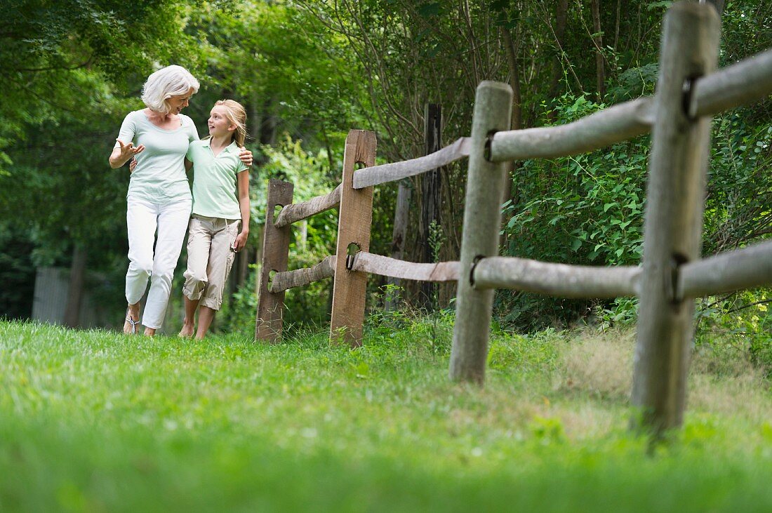 Girl (10-11) and grandmother walking together