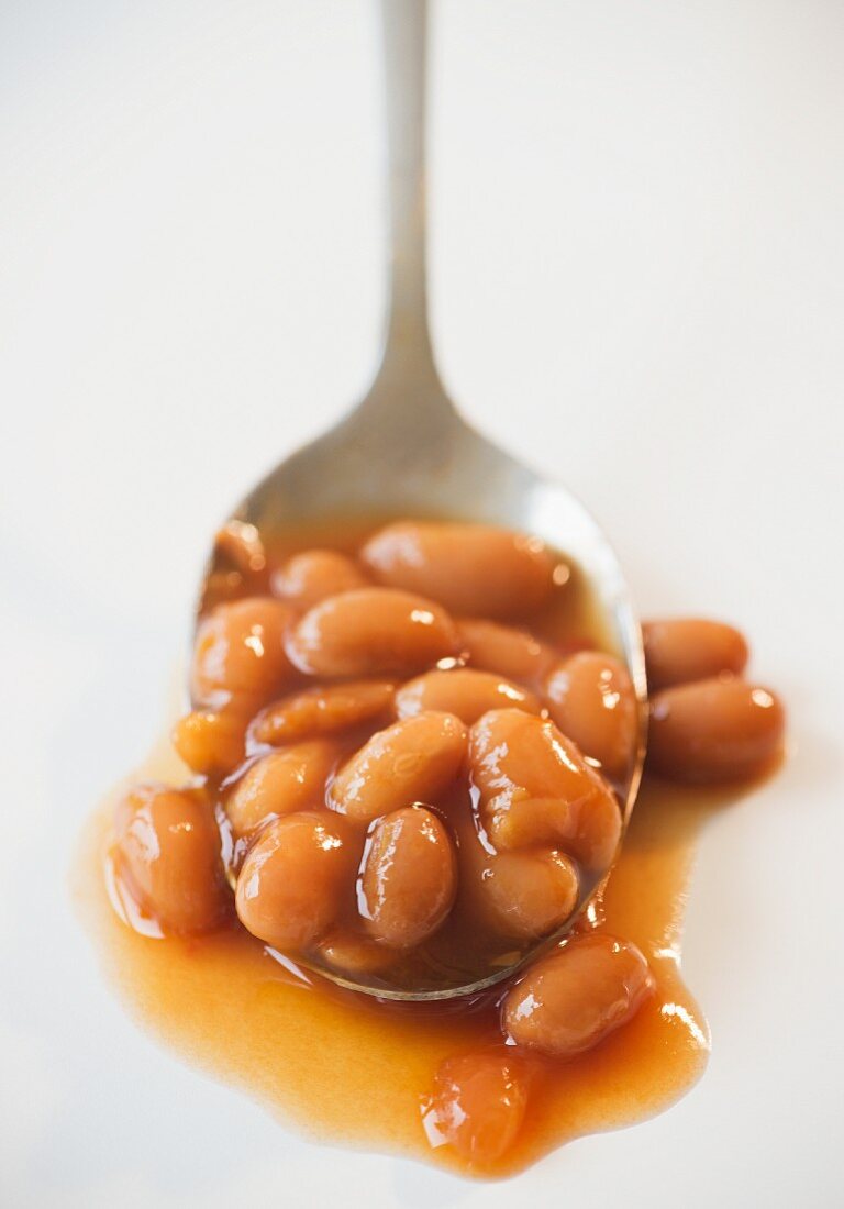 Close up of baked beans on spoon
