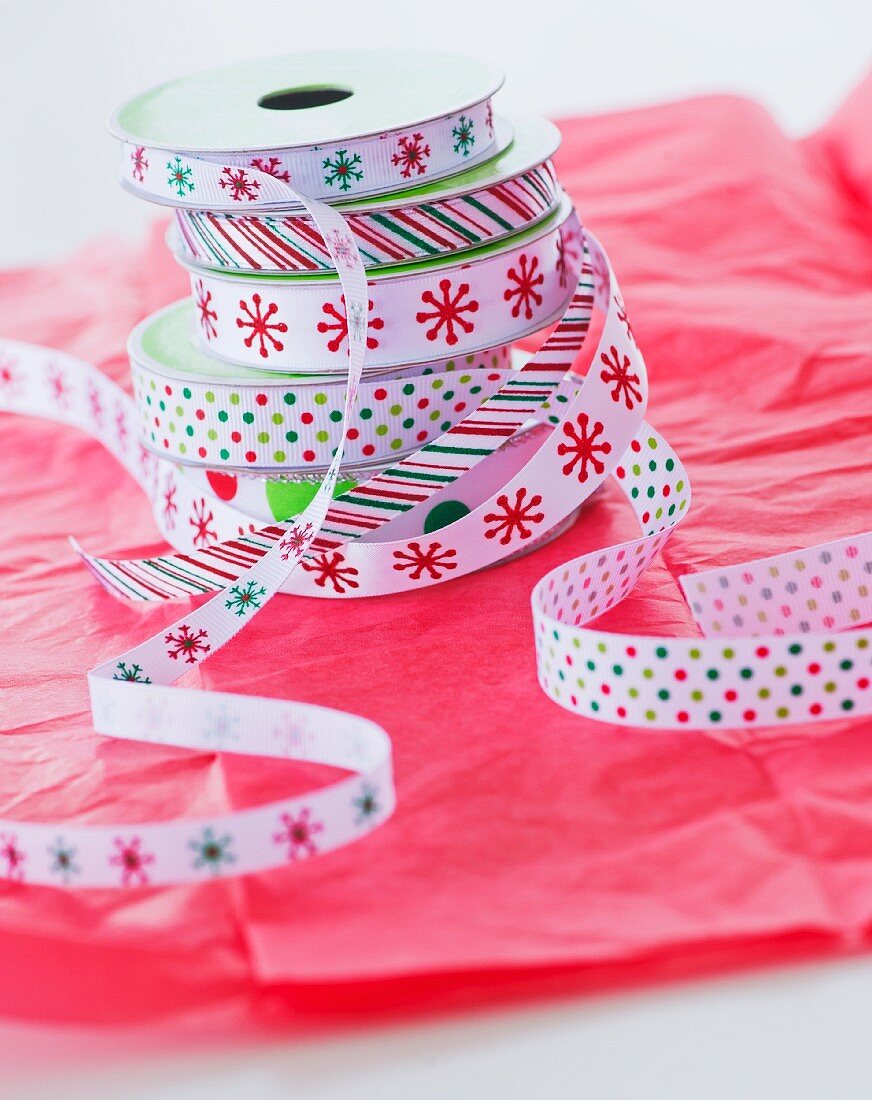 Stack of colorful ribbons on wrapping paper