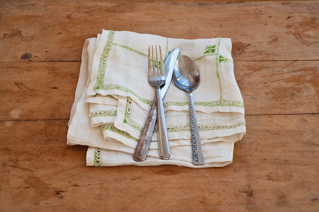 Close up of silverware on dish towel