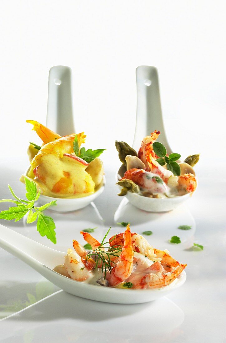 Assorted prawn cocktails on tasting spoons