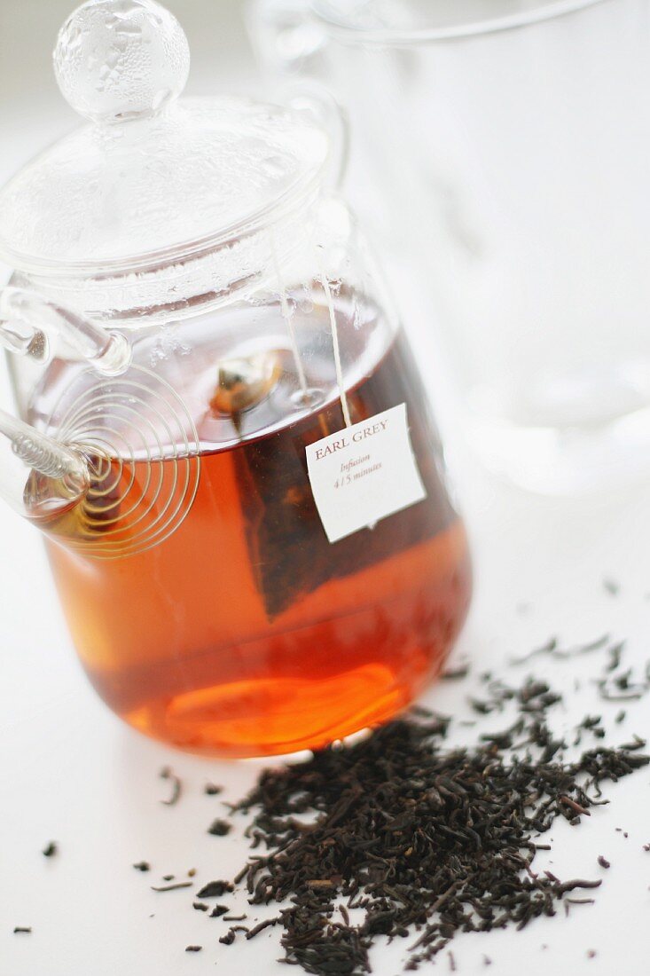 Earl Grey tea with a teabag in a glass jar