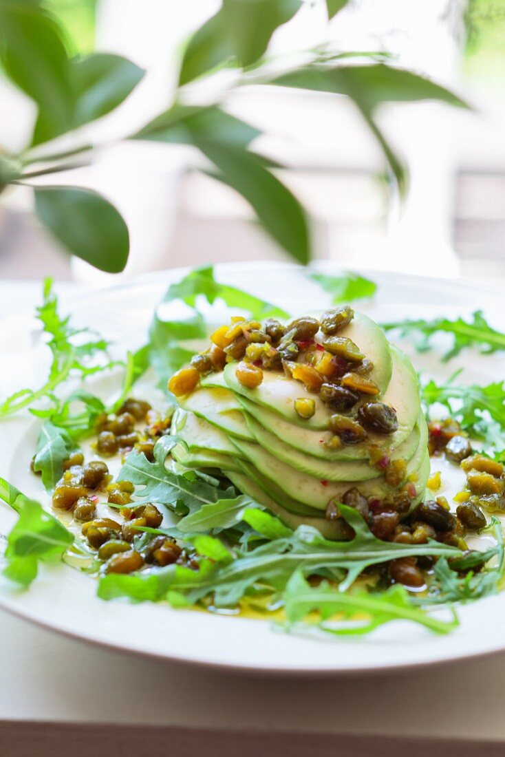 Avocado with pistachios and honey-olive sauce