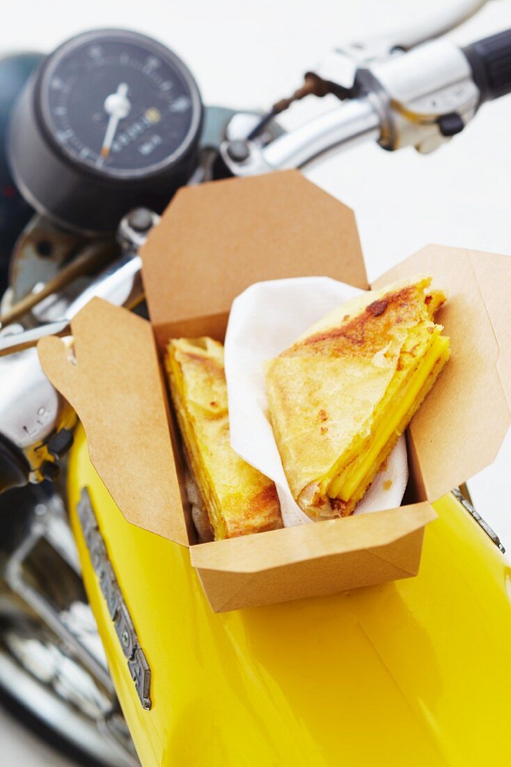 Cheese sandwiches in a cardboard box