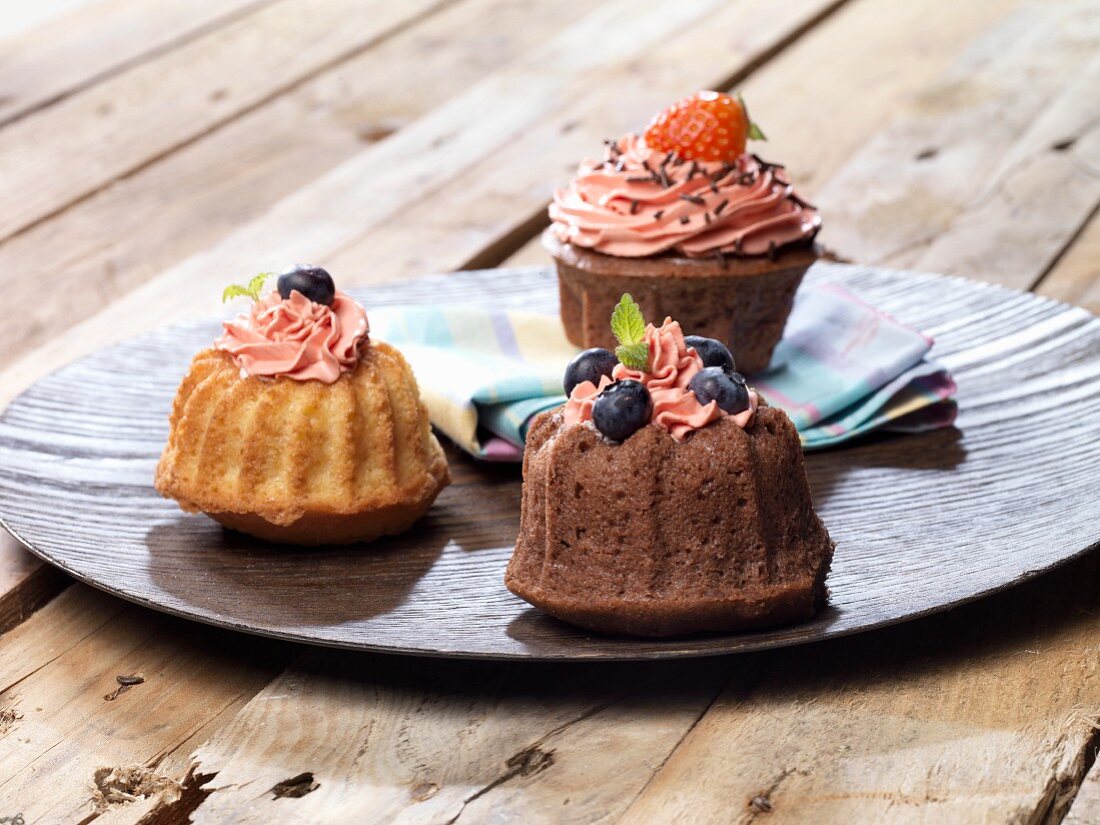 Three mini Bundt cakes with strawberry cream