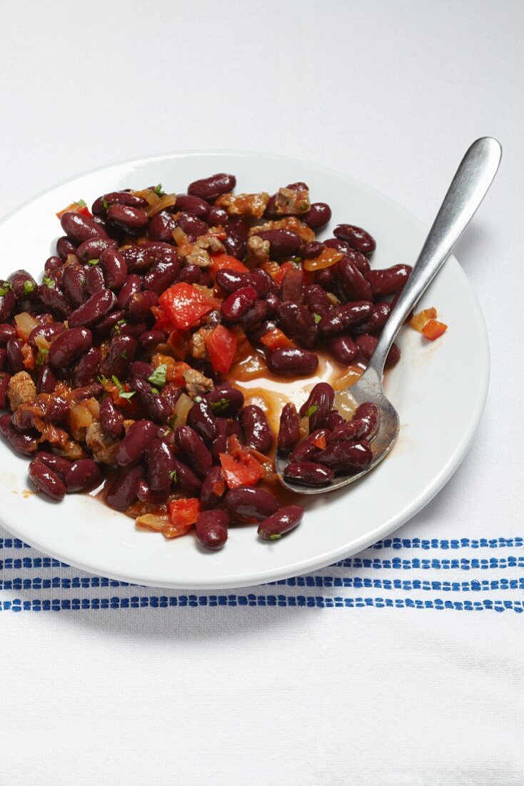 Chili con carne on a plate with a spoon