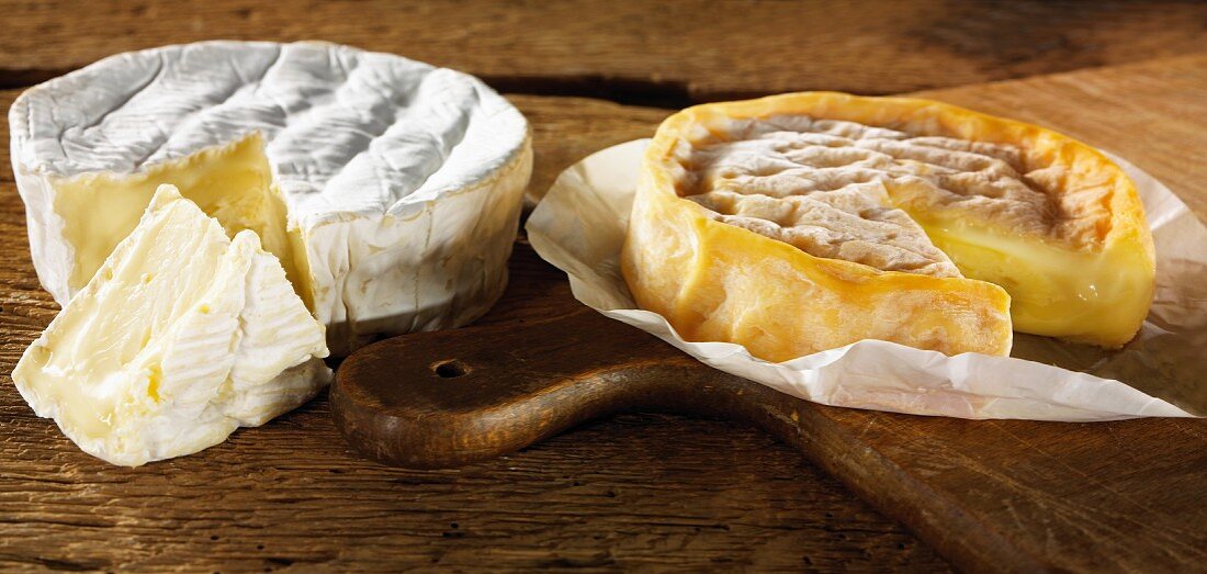 Sliced camembert on a cutting board
