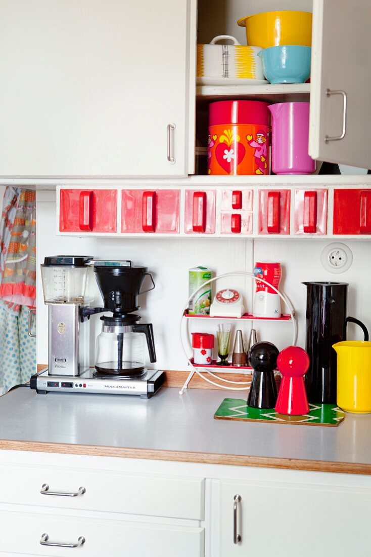 Colourful kitchen utensils in kitchen