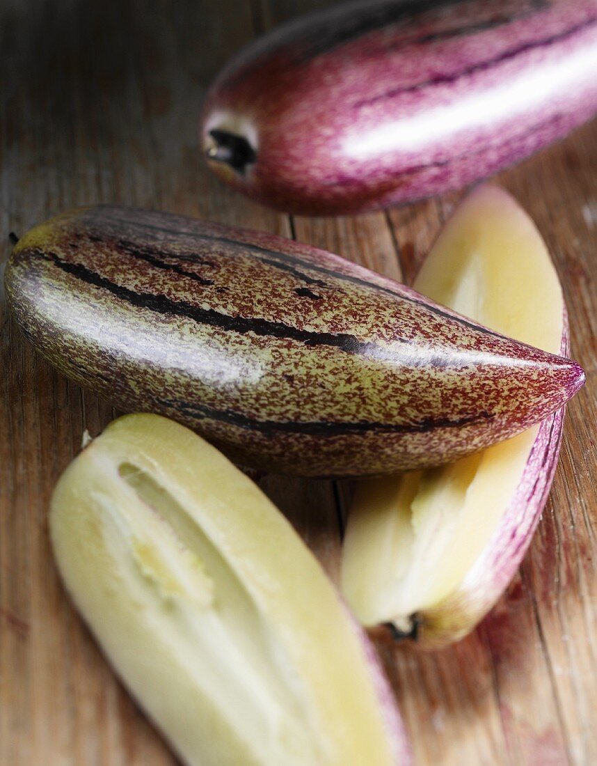 Pepino melons, one whole and one halved