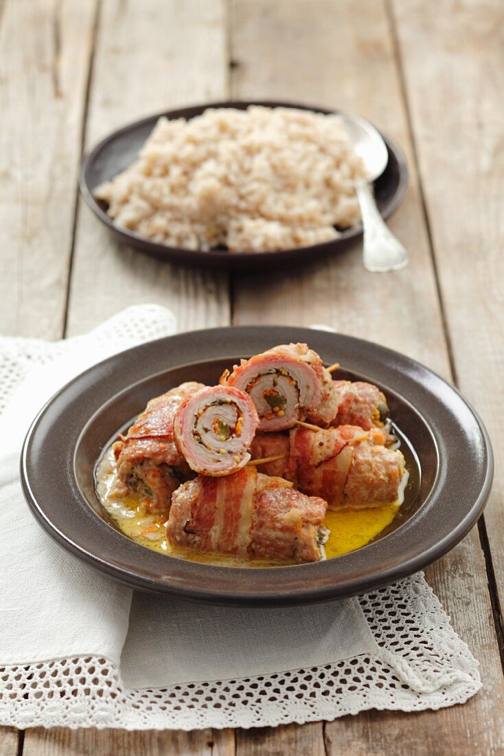 Pork roulades with carrot, cucumber and mustard, wrapped in pancetta