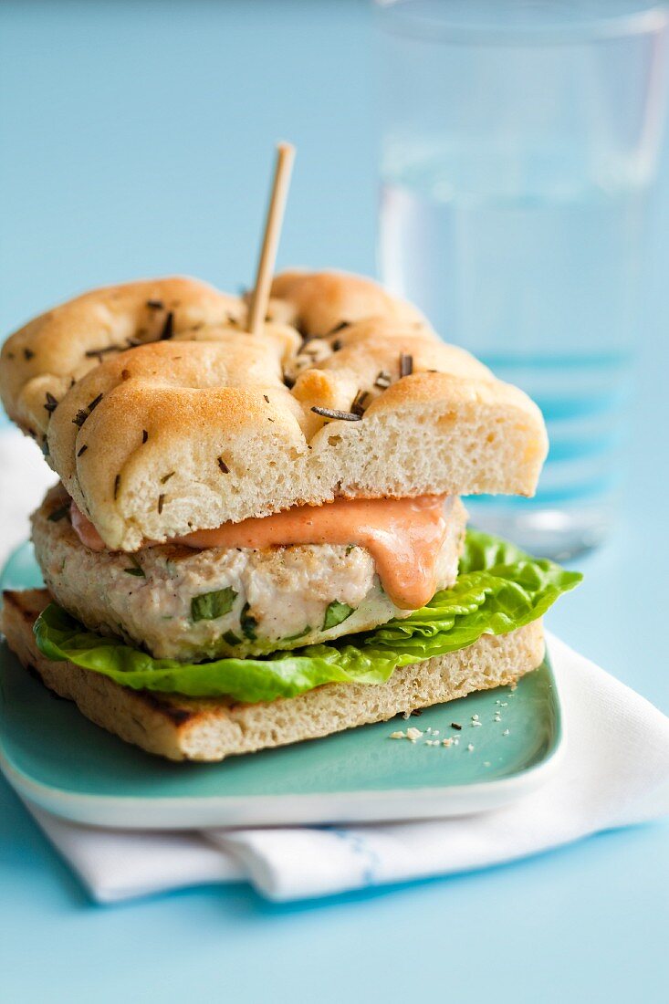 Chicken burger with tomato mayonnaise on focaccia