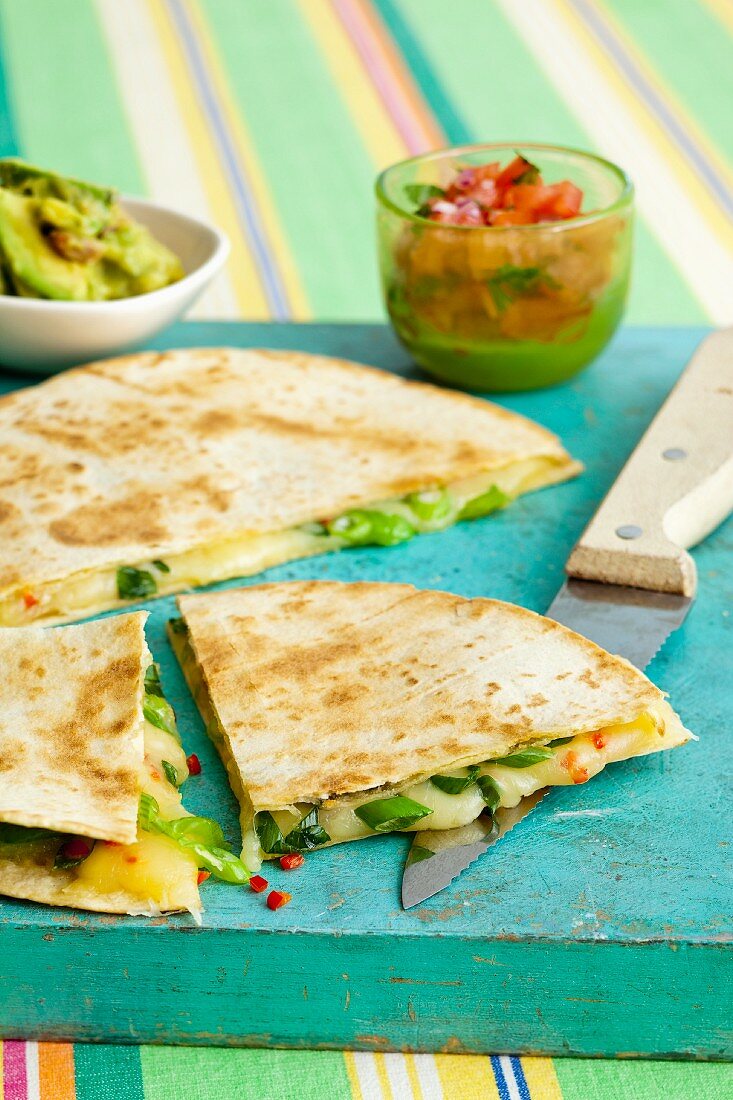 Quesadillas with cheese, spring onions and chili peppers