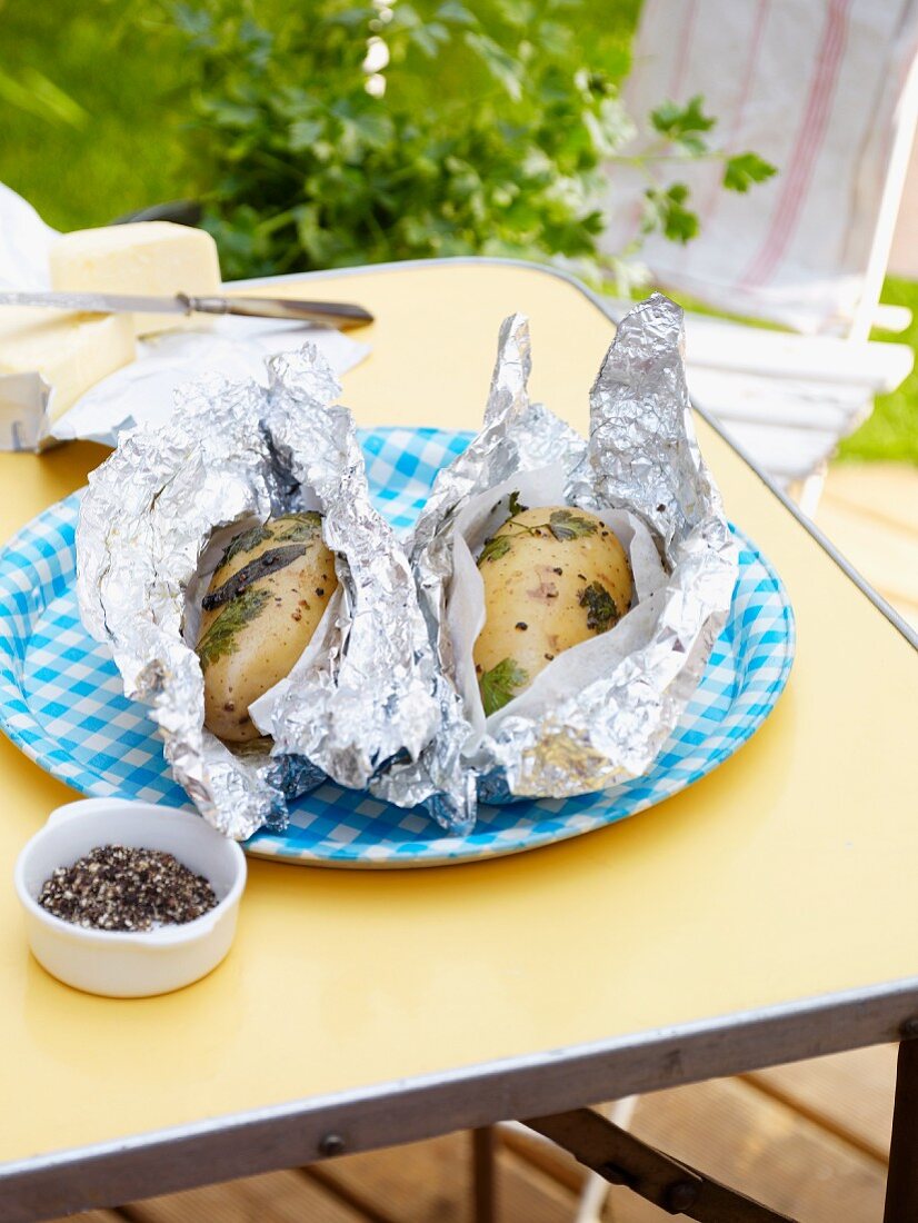 Baked potatoes (foil wrapped) with herbs