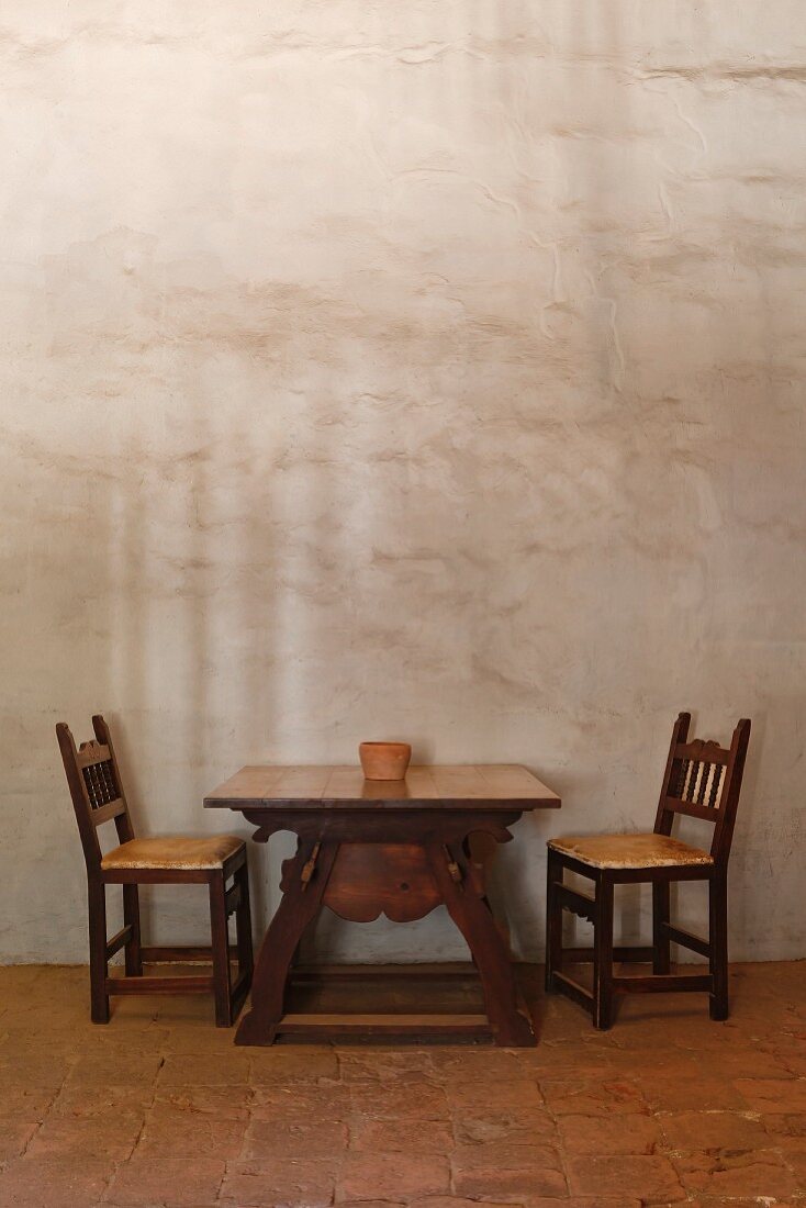 Table and chairs in adobe building at Mission La Purisima State Historic Park, Lompoc, California