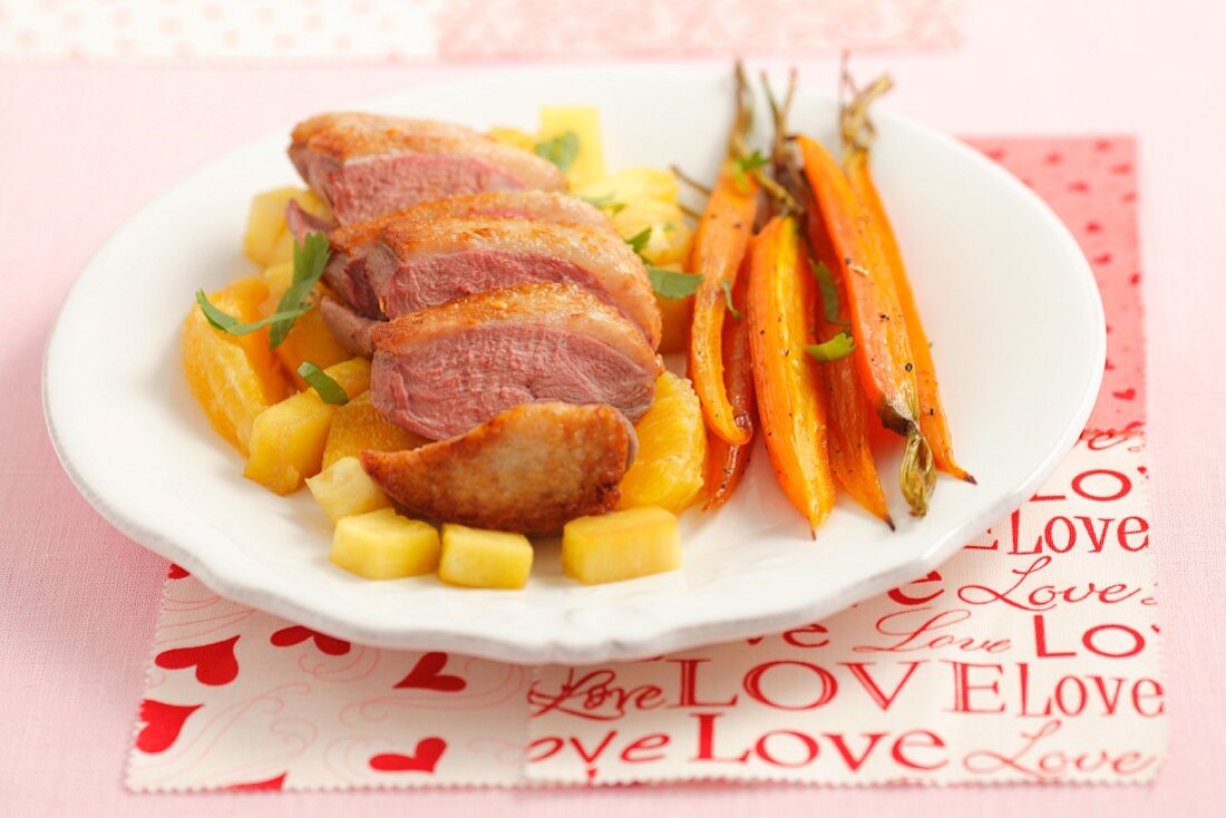 Duck breast with pineapple, oranges and baby carrots