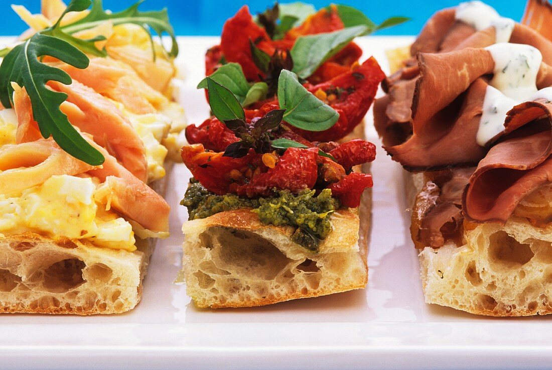 Sliced savoury flatbread with assorted toppings