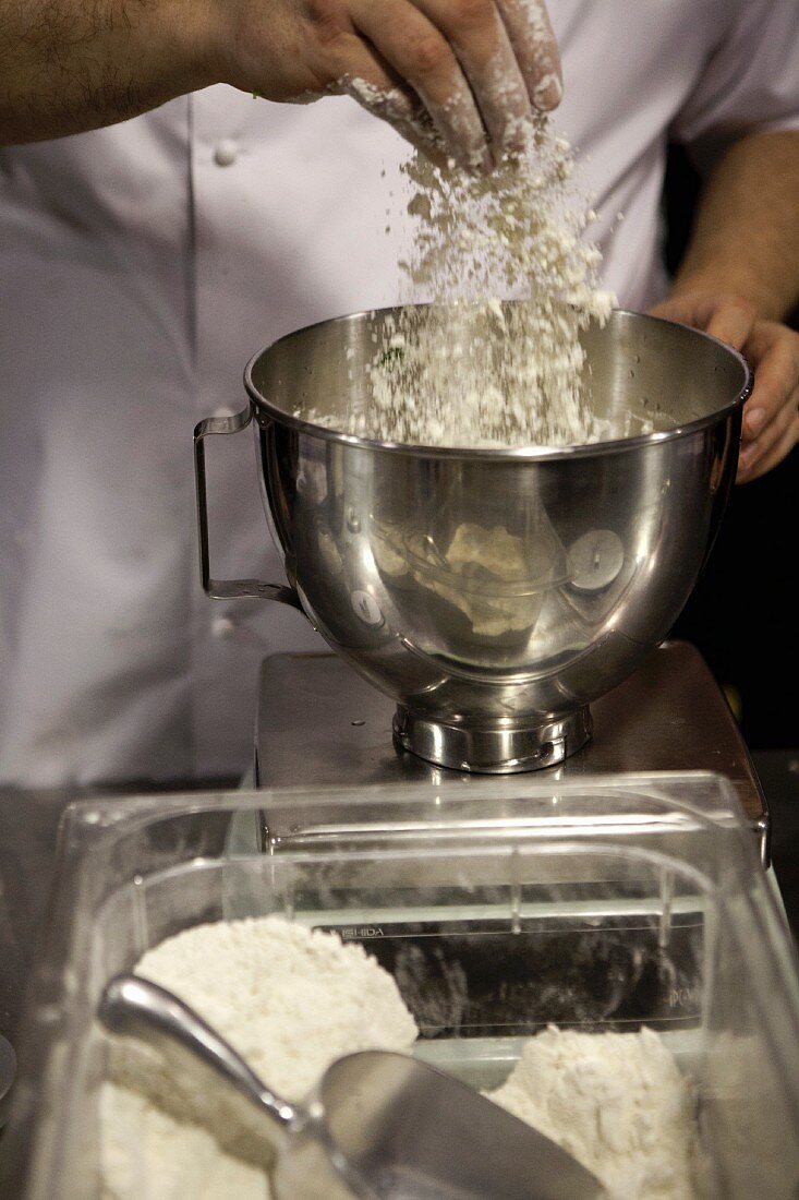 The flour being added