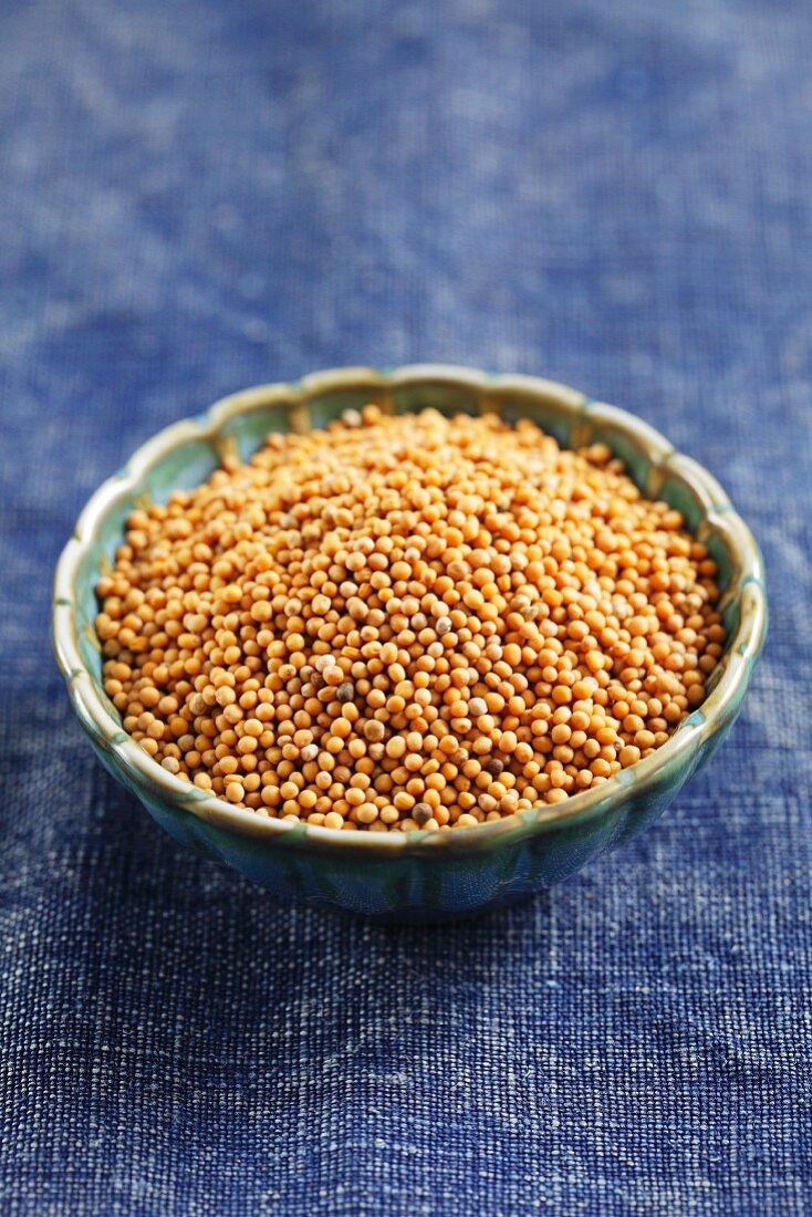 White mustard seeds in a small bowl