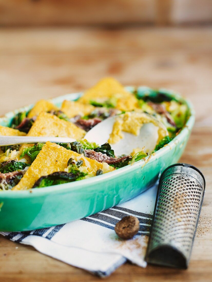 Gratin of polenta, savoy cabbage and anchovies