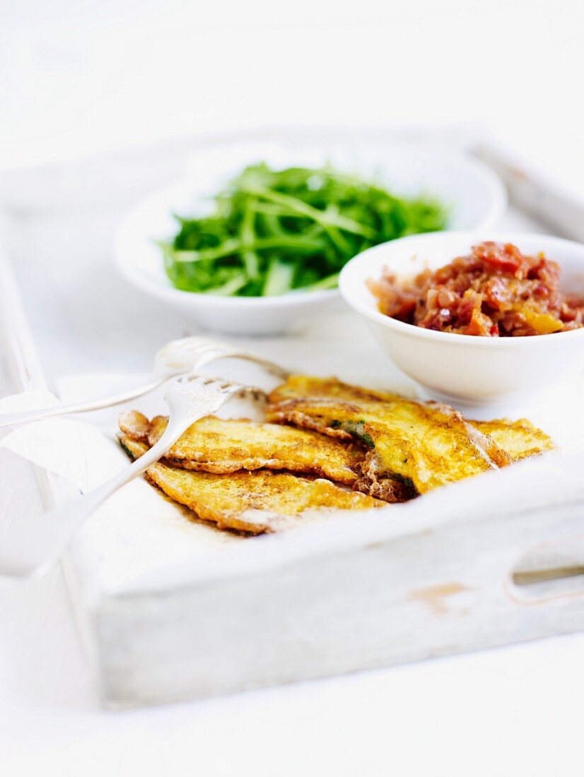 Courgette piccata with tomato chutney and rocket leaves