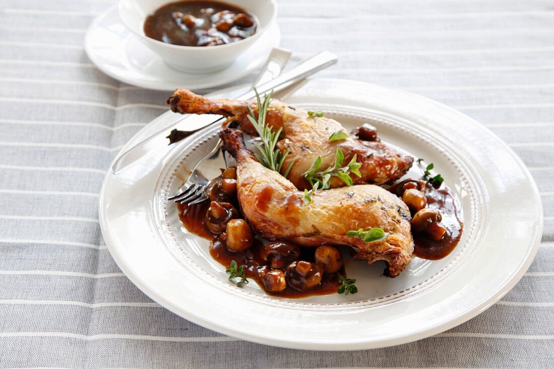Chicken in red wine sauce with mushrooms