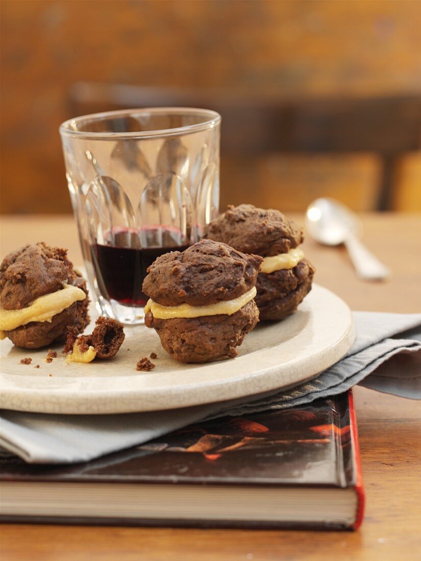 Small chocolate and mocha whoopie pies with a cup of coffee