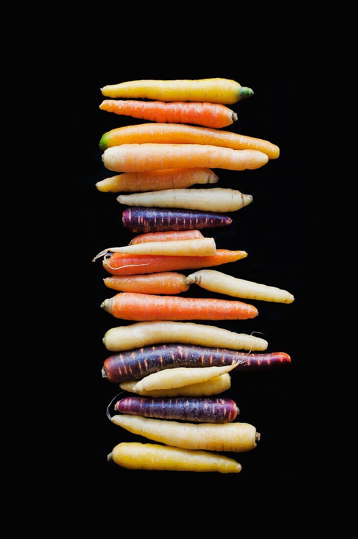 A stack of colourful root vegetables