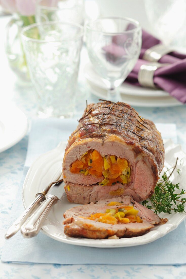 Rolled pork joint stuffed with dried apricots and leek