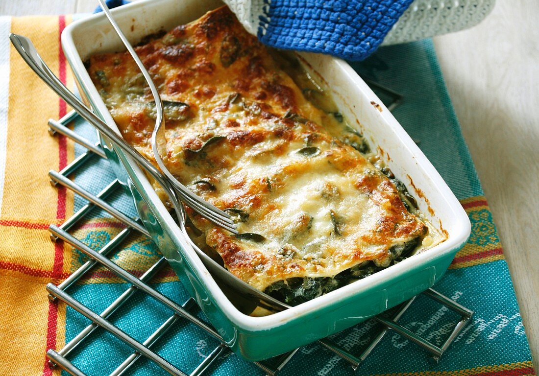 Spinach lasagne in the baking dish