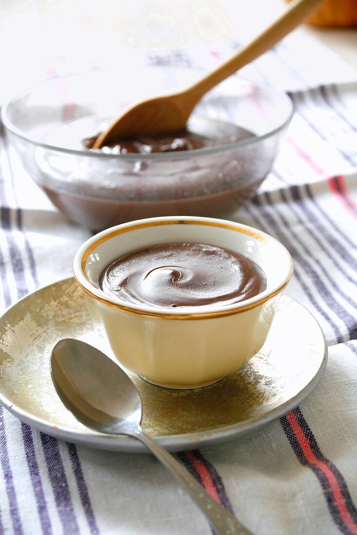 A chocolate mousse in a cup and in a bowl