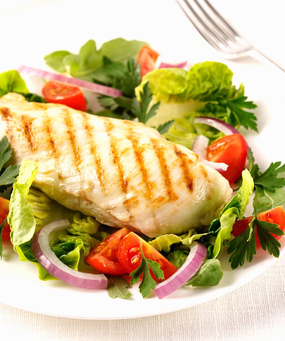Grilled chicken breast with salad