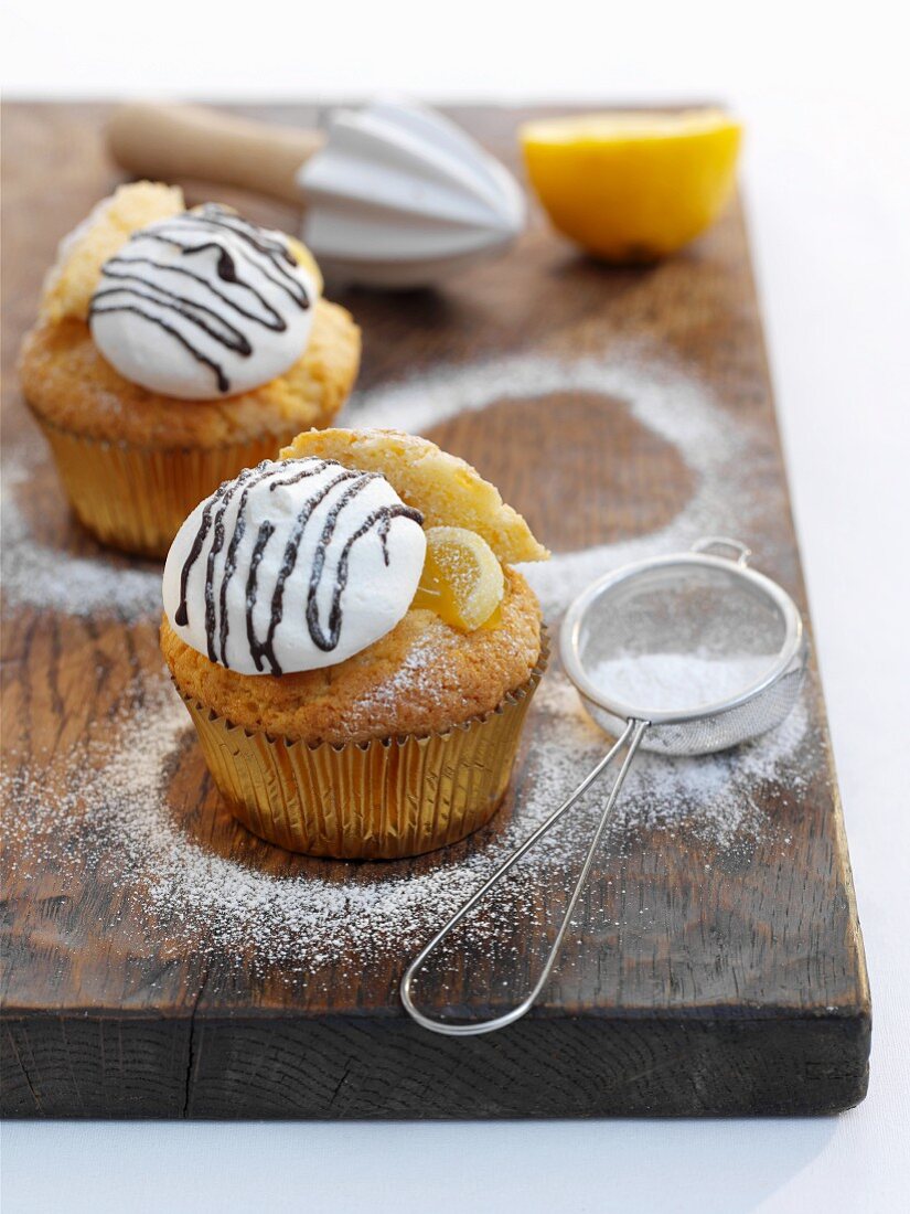 Lemon cupcakes with meringue and icing sugar