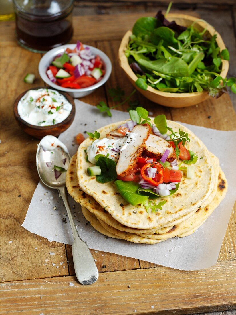 Flatbread with chicken, salad and sour cream