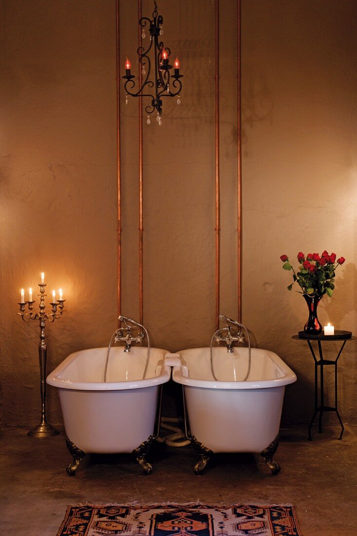 Antique bathtubs in candlelight